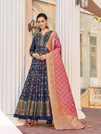 Look Pretty In This Beautiful Readymade Designer Floor Length Gown In Royal Blue Color Paired With Pink Colored Dupatta. This Stitched Gown Are Jacquard And Dupatta Are Banarasi Silk Fabricated On  Beautified With Pretty Jacquard Work. Buy Now.