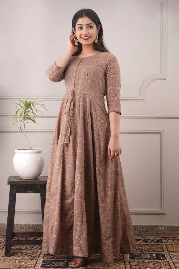 Your Rich And Elegant Taste Wearing This Hand Screen And Foil Printed Designer Readymade Long Gown In Light Brown Color. This  Pretty Gown Is Fabricated On Chanderi with Cotton Crepe Inner Beautified. Its Fabric Is Soft Towards Skin And Easy To Carry All Day Long. 