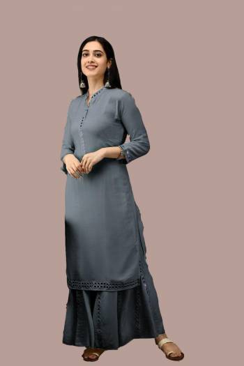 Simple and Elegant Looking Readymade Pair Of Kurti And Plazzo Is Here In Grey Color, This Pretty Pair Is Fabricated On Rayon Beautified With Mirror Work, Also It Is Available In All Regular Sizes.