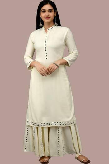 Simple and Elegant Looking Readymade Pair Of Kurti And Plazzo Is Here In White Color, This Pretty Pair Is Fabricated On Rayon Beautified With Mirror Work, Also It Is Available In All Regular Sizes.