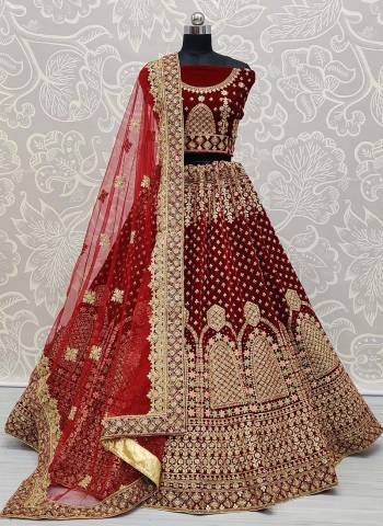 Attrective Look Heavy Designer Lehenga Choli And Dupatta In Maroon Color Fabricated Choli And Lehenga Are Velvet And Dupatta Are Soft Net With Heavy Attractive Jari,Dori Embroidery With Diamond Work. 