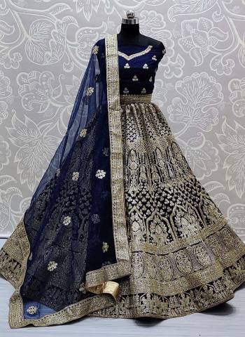 Garb This Heavy Designer Lehenga Choli In All Over Color. This Heavy Embroidered Lehenga Choli Is Net Based Paired With Soft Net Fabricated Dupatta, It Is Beautified With Lovely Detailed Embroidery And Diamond Giving An Attractive Look.
