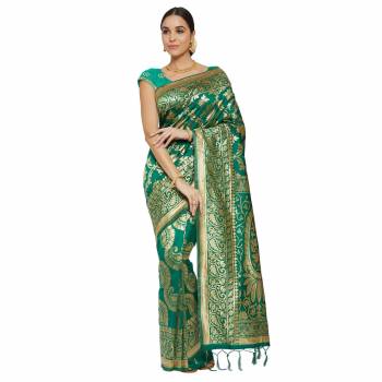 Adorn The Pretty Angelic Look Wearing This Heavy Wevon Designer Saree In Fine Color Paired With Colored Blouse. This Saree Is Fabricated On Banarasi Silk Paired With Blouse. Its Pretty Color Pallete Will Give An Attractive Look To Your Personality. 