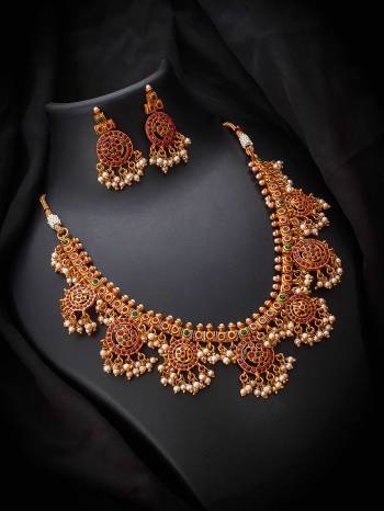 Give An Enhanced Look To Your Personality By Pairing Up This Beautiful Necklace Set With Your Ethnic Attire. This Pretty Set Is In Copper Color Beautified With Kundan Work. Buy Now.