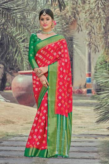 Look Attractive Wearing This Fine Colored Saree Paired With Contrasted Colored Blouse.  This Heavy Designer Wevon Saree Is Silk Based Which Gives A Rich Look To Your Personality. Buy This Pretty Saree Now.