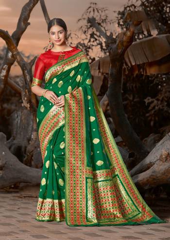 Grab This Pretty Elegant Looking Designer Saree In Dark Color Paired With Contrasting Colored Blouse. This Saree And Blouse Are Silk Based Beautified With Wevon Border And Sirki Work. Buy Now.