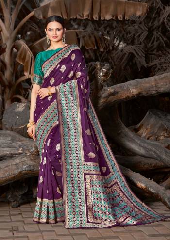 Grab This Pretty Elegant Looking Designer Saree In Dark Color Paired With Contrasting Colored Blouse. This Saree And Blouse Are Silk Based Beautified With Wevon Border And Sirki Work. Buy Now.