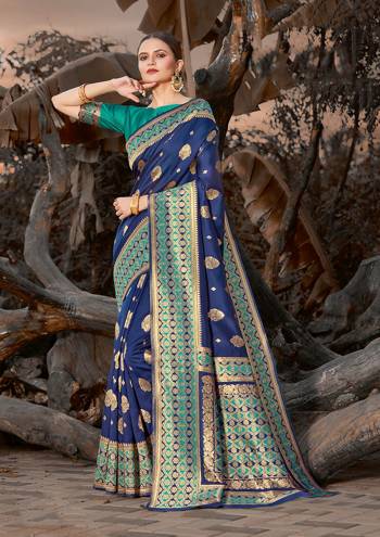 Grab This Pretty Elegant Looking Designer Saree In Dark Color Paired With Contrasting Colored Blouse. This Saree And Blouse Are Silk Based Beautified With Wevon Border And Sirki Work. Buy Now.