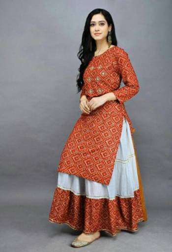 Grab This Designer Readymade Long Kurti With Skrit In Fine Color Fabricated On Rayon. It Is Beautified With Bandhej Block Prints And You Can Pair This Up With Tui Lace For A Festive Look. Buy Now.