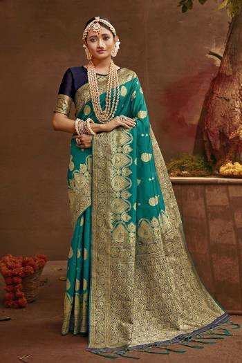 Celebrate This Festive Season In This Very Pretty Fine Colored Designer Saree Paired With Contrasting Blouse. This Saree and Blouse Are Banarasi Silk Based Beautified With Detailed Wevon Heavy Deasigner Work. 