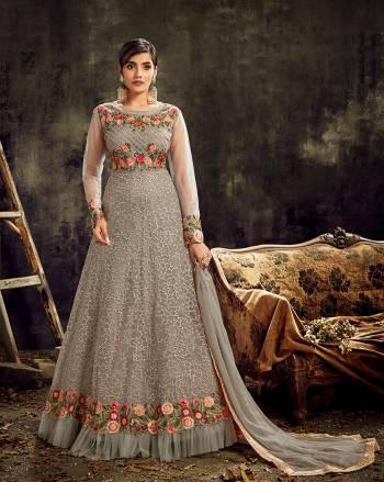 Look sensationally awesome with this lovely Butterfly Net Fabric floor length anarkali suit. The fantastic attire creates a dramatic Stone Work with wonderful heavy embroidered suit. Comes with matching bottom and Lace Border dupatta.