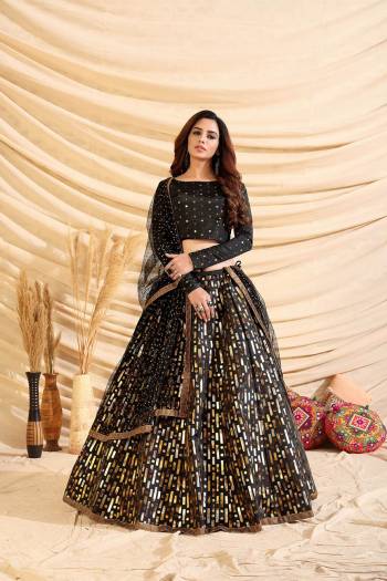 Garb This Heavy Designer Lehenga Choli In All Over Color. This Heavy Pigment With Foil Printed Lehenga Choli Is Tafetta Silk Based Paired With Net Fabricated Dupatta, It Is Beautified With Lovely Attractive Look.