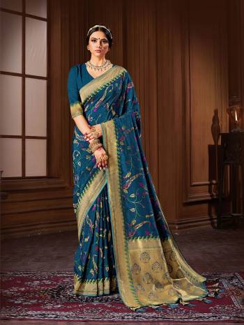 Rich Look This Pretty Elegant Looking Designer Party Wear Saree In Light Color Paired With Blouse. This Saree And Blouse Are Banarasi Silk Based With Heavy Designer Wevon Work Beautified Saree. Buy Now.