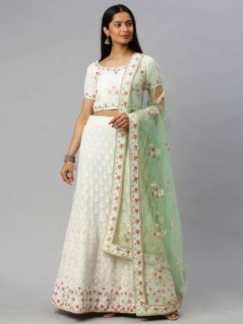 Traditional Look This Heavy Designer Lehenga Choli In All Over Light Color. This Heavy Designer Lakhnavi Embroidery Work Lehenga Choli Are Georgette And Dupatta Is Net Based Paired, It Is Beautified With Lovely Attractive Look.