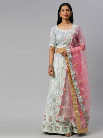 Traditional Look This Heavy Designer Lehenga Choli In All Over Light Color. This Heavy Designer Lakhnavi Embroidery Work Lehenga Choli Are Georgette And Dupatta Is Net Based Paired, It Is Beautified With Lovely Attractive Look.