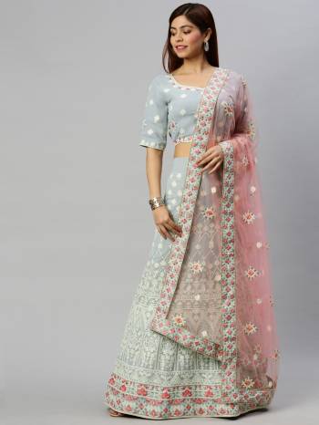 Traditional Look This Heavy Designer Lehenga Choli In All Over Light Color. This Heavy Designer Lakhnavi Embroidery Work Lehenga Choli Are Georgette And Dupatta Is Net Based Paired, It Is Beautified With Lovely Attractive Look.