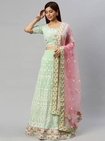 Traditional Look This Heavy Designer Lehenga Choli In All Over Light Color. This Heavy Designer Lakhnavi Embroidery Work Lehenga Choli Are Georgette And Dupatta Is Net Based Paired, It Is Beautified With Lovely Attractive Look.