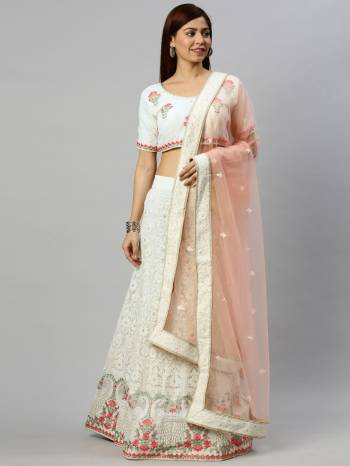 Traditional Look This Heavy Designer Lehenga Choli In All Over Light Color. This Heavy Designer Lakhnavi Embroidery Work Lehenga Choli Are Georgette And Dupatta Is Net Based Paired, It Is Beautified With Lovely Attractive Look.