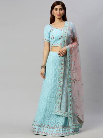 Traditional Look This Heavy Designer Lehenga Choli In All Over Light Color. This Heavy Designer Lakhnavi Embroidery Work Lehenga Choli Are Georgette And Dupatta Is Net Based Paired, It Is Beautified With Lovely Attractive Look.