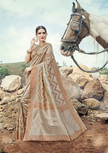 Traditioal Look This Pretty Elegant Looking Designer Party Wear Saree In Light Color Paired With Blouse. This Saree And Blouse Are Banarasi Silk Based With Heavy Weving Designer Work Beautified Saree. Buy Now.