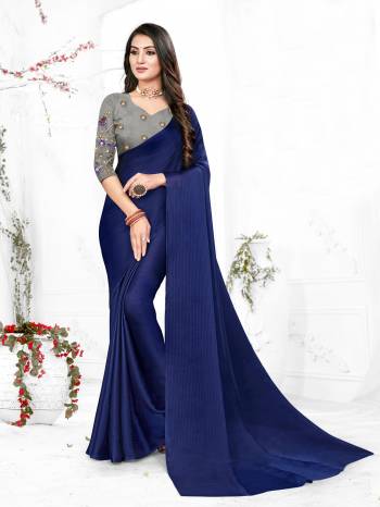 Adorn The Pretty Angelic Look Wearing This Heavy Wevon Designer Saree In Fancy Color Paired With Contrasting Grey Colored Blouse. This Saree Is Fabricated On Chiffon Paired With Micro Fabricated Blouse. Its Pretty Color Pallete Will Give An Attractive Look To Your Personality. 