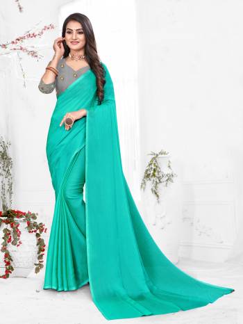 Adorn The Pretty Angelic Look Wearing This Heavy Wevon Designer Saree In Fancy Color Paired With Contrasting Grey Colored Blouse. This Saree Is Fabricated On Chiffon Paired With Micro Fabricated Blouse. Its Pretty Color Pallete Will Give An Attractive Look To Your Personality. 