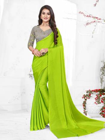 Adorn The Pretty Angelic Look Wearing This Heavy Wevon Designer Saree In Fancy Color Paired With Contrasting Grey Colored Blouse. This Saree Is Fabricated On Chiffon Paired With Micro Fabricated Blouse. Its Pretty Color Pallete Will Give An Attractive Look To Your Personality. 