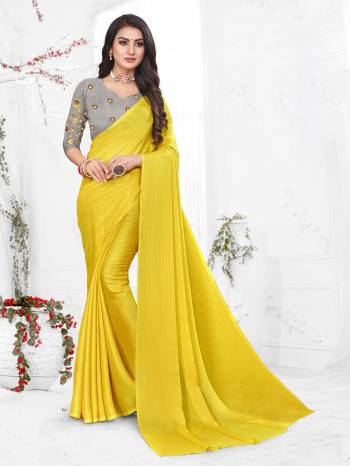 Adorn The Pretty Angelic Look Wearing This Heavy Wevon Designer Saree In Fancy Color Paired With Contrasting Grey Colored Blouse. This Saree Is Fabricated On Chiffon Paired With Micro Fabricated Blouse. Its Pretty Color Pallete Will Give An Attractive Look To Your Personality. 