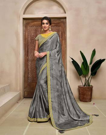 Rich Look This Pretty Elegant Looking Designer Party Wear Saree In Fine Color Paired With Contrasted Colored Blouse. This Saree And Blouse Are Heavy Silk Based With Designer Fiol Printed With Embroidery Work Beautified Saree. Buy Now.