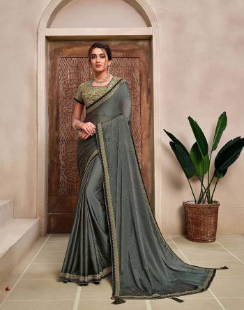 Rich Look This Pretty Elegant Looking Designer Party Wear Saree In Fine Color Paired With Contrasted Colored Blouse. This Saree And Blouse Are Heavy Silk Based With Designer Fiol Printed With Embroidery Work Beautified Saree. Buy Now.