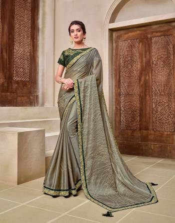 Rich Look This Pretty Elegant Looking Designer Party Wear Saree In Fine Color Paired With Contrasted Colored Blouse. This Saree And Blouse Are Heavy Silk Based With Designer Fiol Printed With Embroidery Work Beautified Saree. Buy Now.