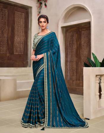 Rich Look This Pretty Elegant Looking Designer Party Wear Saree In Fine Color Paired With Contrasted Colored Blouse. This Saree And Blouse Are Heavy Silk Based With Designer Fiol Printed With Embroidery Work Beautified Saree. Buy Now.