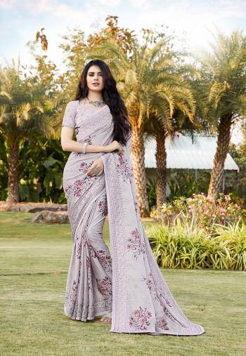 Rich Look This Pretty Elegant Looking Designer Party Wear Saree In Fine Light Color Paired With Blouse. This Saree Are Satin Silk And Blouse Are Banlori Silk With Digital Printed,Multy Embroidery,Swaroski Stone Work With  Embroidery Work Blouse Beautified Saree. Buy Now.