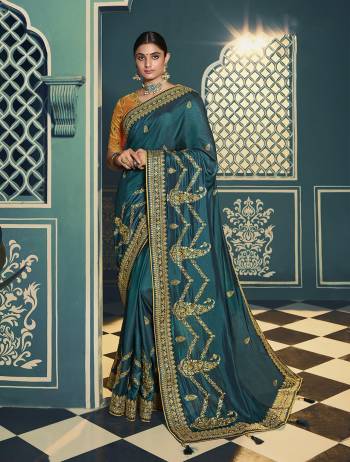 Adorn The Pretty Angelic Look Wearing This Heavy Designer Saree In Fine Color Paired With Contrasting Colored Blouse. This Saree Is Fabricated On Chiffon Paired With Art Silk Fabricated Blouse. Its Pretty Color Pallete Will Give An Attractive Look To Your Personality. 