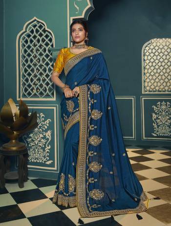 Adorn The Pretty Angelic Look Wearing This Heavy Designer Saree In Fine Color Paired With Contrasting Colored Blouse. This Saree Is Fabricated On Chiffon Paired With Art Silk Fabricated Blouse. Its Pretty Color Pallete Will Give An Attractive Look To Your Personality. 