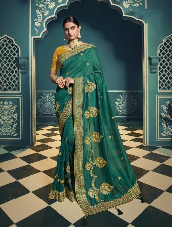 Adorn The Pretty Angelic Look Wearing This Heavy Designer Saree In Fine Color Paired With Contrasting Colored Blouse. This Saree Is Fabricated On Chiffon Paired With Art Silk Fabricated Blouse. Its Pretty Color Pallete Will Give An Attractive Look To Your Personality. 