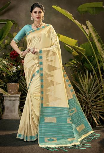 Celebrate This Festive Season In This Very Pretty Cream Colored Designer Saree Paired With Contrasting Colored Blouse. This Saree and Blouse Are Art Silk Based Beautified With Detailed Wevon Jari Designer Work. 