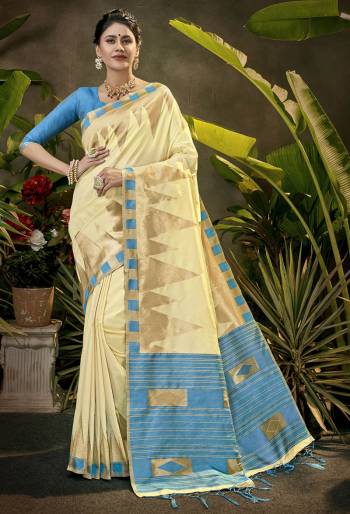 Celebrate This Festive Season In This Very Pretty Cream Colored Designer Saree Paired With Contrasting Colored Blouse. This Saree and Blouse Are Art Silk Based Beautified With Detailed Wevon Jari Designer Work. 