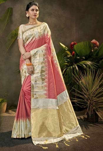 Celebrate This Festive Season In This Very Pretty Light Colored Designer Saree Paired With Contrasting Cream Colored Blouse. This Saree and Blouse Are Art Silk Based Beautified With Detailed Wevon Jari Designer Work. 