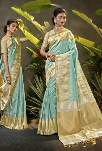 Celebrate This Festive Season In This Very Pretty Light Colored Designer Saree Paired With Contrasting Cream Colored Blouse. This Saree and Blouse Are Art Silk Based Beautified With Detailed Wevon Jari Designer Work. 