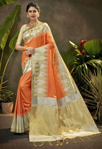 Celebrate This Festive Season In This Very Pretty Light Colored Designer Saree Paired With Contrasting Cream Colored Blouse. This Saree and Blouse Are Art Silk Based Beautified With Detailed Wevon Jari Designer Work. 