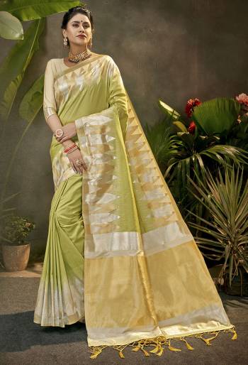 Celebrate This Festive Season In This Very Pretty Light Colored Designer Saree Paired With Contrasting Cream Colored Blouse. This Saree and Blouse Are Art Silk Based Beautified With Detailed Wevon Jari Designer Work. 