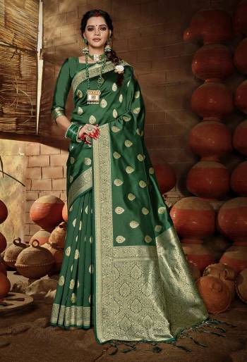 Grab This Pretty Elegant Looking Designer Saree In Dark Color Paired With Blouse. This Saree And Blouse Are Banarasi Silk Based Beautified With Weving Jari Jacquard Work. Buy Now.