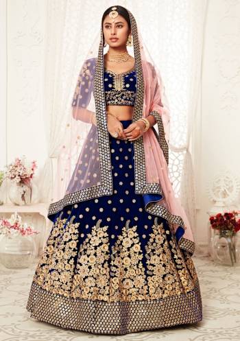 Garb This Heavy Designer Lehenga Choli In All Over Color. This Heavy Embroidered Lehenga Choli Is Velvet Based Paired With Soft Net Fabricated Dupatta, It Is Beautified With Lovely Detailed Heavy Embroidery Giving An Attractive Look.