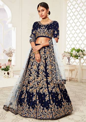 Garb This Heavy Designer Lehenga Choli In All Over Color. This Heavy Embroidered Lehenga Choli Is Velvet Based Paired With Soft Net Fabricated Dupatta, It Is Beautified With Lovely Detailed Heavy Embroidery Giving An Attractive Look.