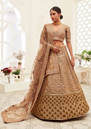 Garb This Heavy Designer Lehenga Choli In All Over Color. This Heavy Embroidered Lehenga Choli Is Slub Silk Based Paired With Soft Net Fabricated Dupatta, It Is Beautified With Lovely Detailed Heavy Embroidery Giving An Attractive Look.