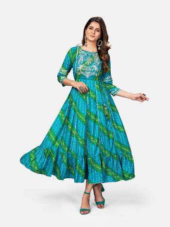 For Your Semi-Casuals, Grab This Designer Readymade Long Kurti In Fine Color Fabricated On Rayon. It Is Beautified With Designer Printed And Embroidery And You Can Pair This Up With Accessories For A Festive Look. Buy Now.