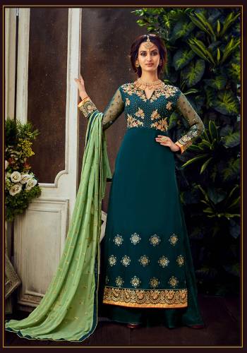 Attrective Look The Upcoming Festive And Wedding Season With This Designer Suit In Teal Color Paired With Dupatta. Its Heacy Embroidered Top Is Fabricated On Georgette Paired With Santoon Bottom And Chiffon Fabricated Dupatta. Buy this Suit Now.