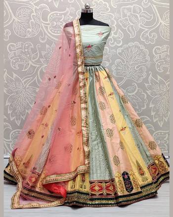 Garb This Heavy Designer Lehenga Choli In Light Color. This Heavy Multy,Sequance,Dori,Real Mirroe Embroidered Lehenga Choli Is Silk Based Paired With Soft Net Fabricated Dupatta, It Is Beautified With Lovely Detailed Embroidery Giving An Attractive Look.