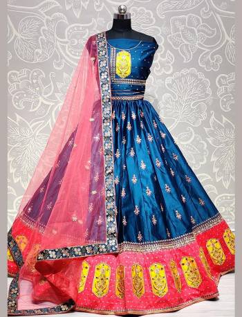 This Heavy Designer Lehenga Choli In Fine Color. This Heavy Embroidered Lehenga Choli Is Satin Silk Based Paired With Soft Net Fabricated Dupatta, It Is Beautified With Lovely Detailed Thread,Jari,Mirror Embroidery Giving An Attractive Look.